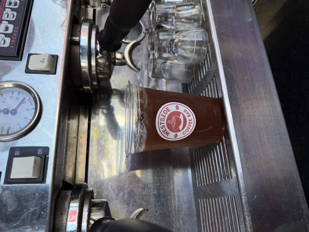 Espresso pulled into a Westside Coffee Bar cup on the machine