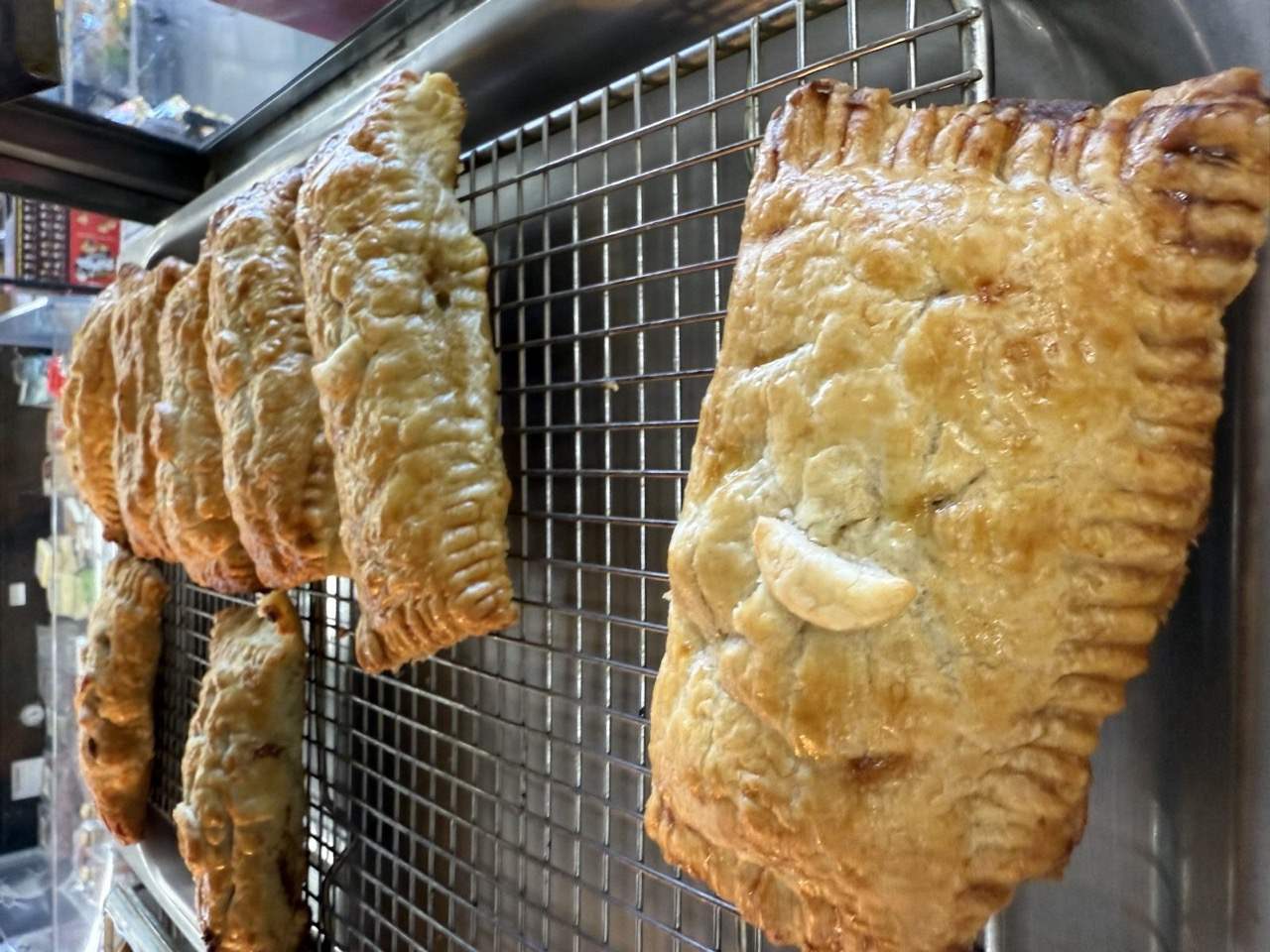 Golden garage pies fresh on the rack at Westside Market