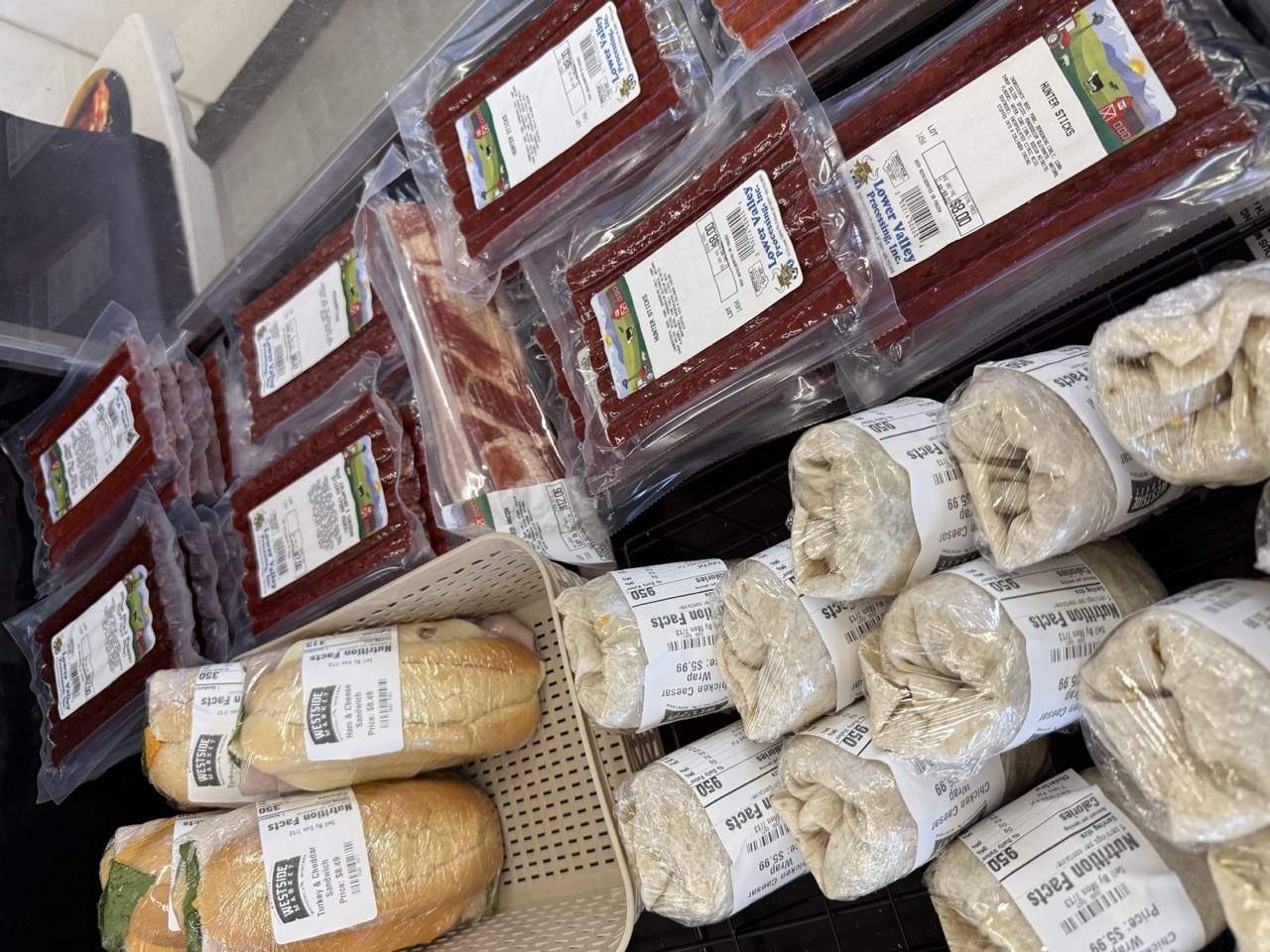 Wrapped subs, burritos, and local jerky ready to grab and go at Westside Market